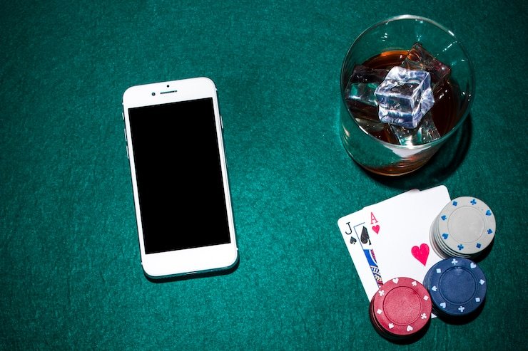 Mobile phone displaying live roulette table with dealer in HD video stream